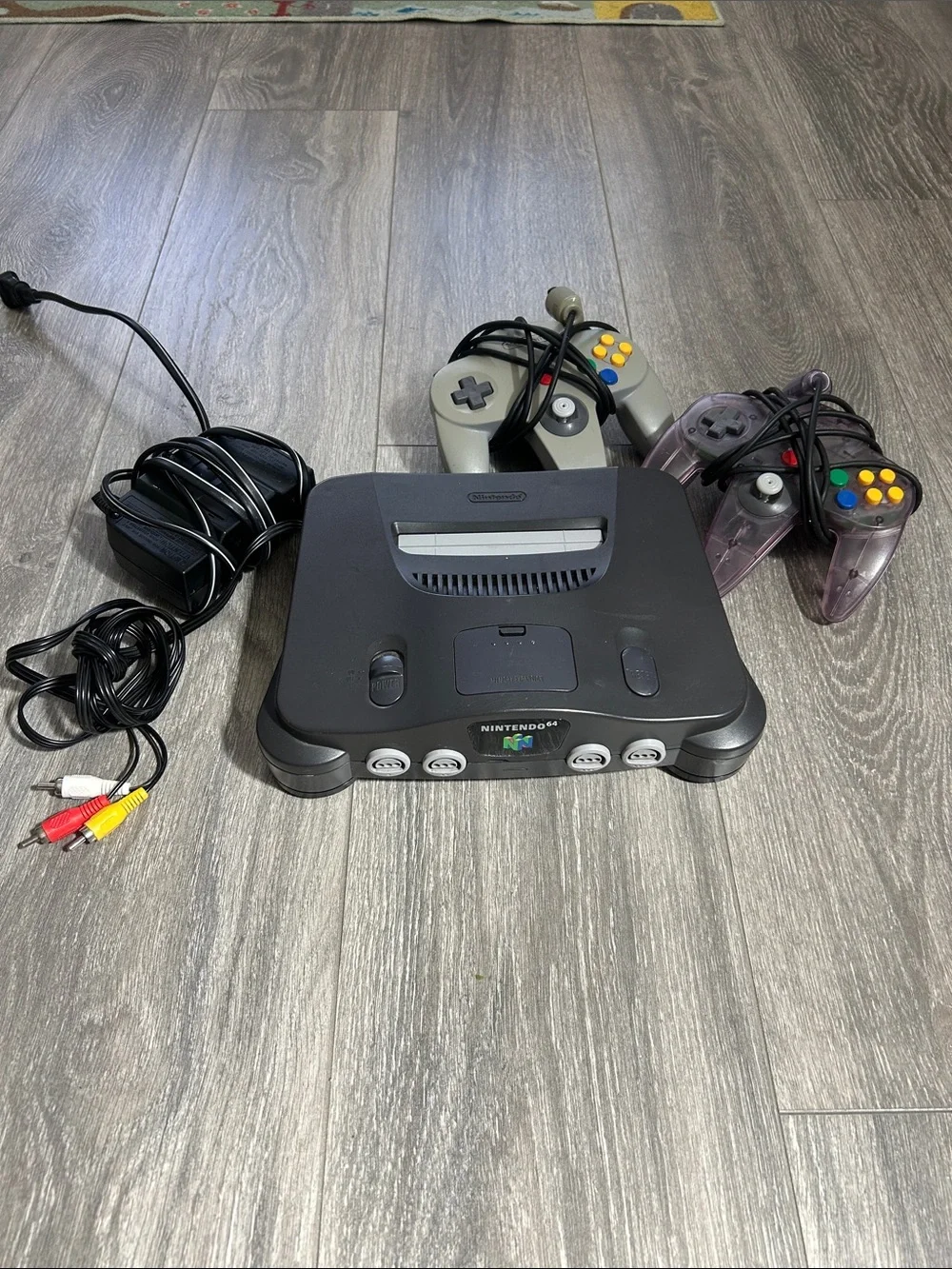 Nintendo 64 Console with Black Shell and Translucent Purple Controller